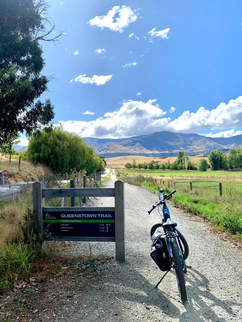 The bike that I rode placed beside one of the signage of Countryside Trail in Queenstown.